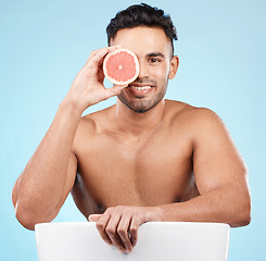 Image showing Beauty, health and portrait of man with grapefruit for fruit detox, healthy body or natural facial skincare routine. Wellness spa salon, vitamin c glow and happy nutritionist model with food product