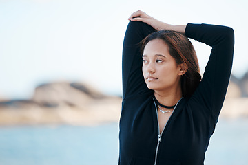 Image showing Woman stretching with fitness, running at beach for exercise and body training outdoor mockup. Young runner, warm up and start run with cardio, wellness and health by ocean for workout lifestyle.