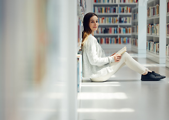 Image showing Reading, education and portrait of a woman in a library for college research, learning information and book knowledge. Scholarship, happy and student at university studying law from books on campus