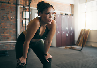 Image showing Tired, exercise and woman at gym after fitness workout or training for health and body wellness. Young sports female or athlete resting on break while thinking about goals, progress and performance