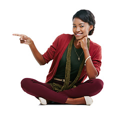 Image showing Black woman, smile portrait and pointing finger, relax sitting isolated in white background for advertising mockup. African girl, happy and point for marketing, product placement or idea vision