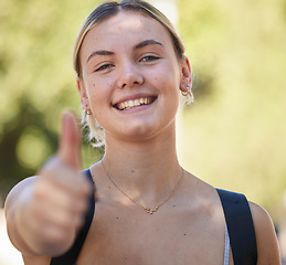 Image showing Portrait, woman and thumbs up in nature while outdoor for freedom, happiness and support for summer travel adventure. Happy young female with hand sign and backpack for motivation, peace and wellness