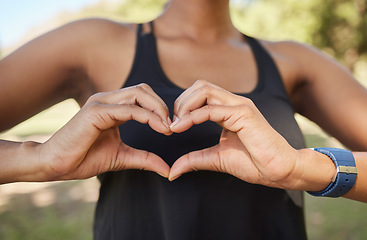 Image showing Hands, fitness or black woman in nature with heart sign in training, exercise or park workout in summer. Love, zoom or healthy African sports girl with hope, goals or loving hand gesture in Nigeria