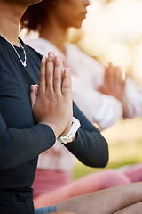 Image showing Women, namaste hands and yoga meditation at park, wellness and freedom of chakra energy, zen fitness or peace. Closeup of calm friends, relax exercise and meditate in nature for mental health balance