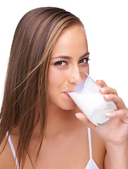 Image showing Milk, drink and portrait of woman on studio, isolated white background and healthy diet. Face of female model, glass and dairy for breakfast, nutrition and dairy with protein, vitamins and calcium