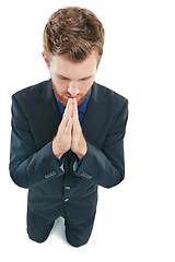 Image showing Business man, prayer hands and kneeling for help, sorry or gratitude isolated on a white background. Male in suit praying for donation, support or forgiveness with hope or thank you emoji in studio