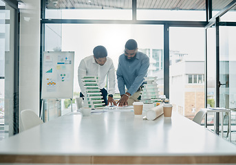 Image showing Planning, building model and architecture team analyzing a construction blueprint in an office. Teamwork, collaboration and industrial workers working on real estate development with 3d design.