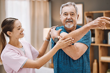 Image showing Senior man, nurse and physiotherapy in home visit for healthcare, recovery and healing. Stretching, physical therapy and female medical caregiver helping old male with rehabilitation of arm in house.