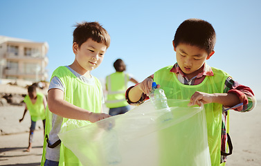 Image showing Recycling, plastic and asian children at beach cleaning for education, learning and community help in climate change project, ngo and charity. Seoul friends with waste, garbage or trash for earth day