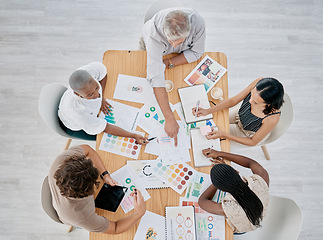 Image showing Team work, hands or creative business people in a meeting planning branding, logo or marketing color on paper. Designers, top view or employees working with senior manager on strategy or stats goals