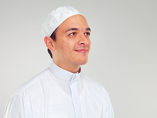 Image showing Islam, culture and portrait of muslim man with smile on face in ramadan isolated on grey background. Youth, spiritual wellness and religion, happy Islamic scholar in white from Saudi Arabia in studio