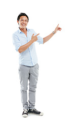 Image showing Man, happy and portrait while pointing finger at mockup space for advertising promotion or sale. Male with hands for marketing brand, logo or product placement deal isolated on a white background