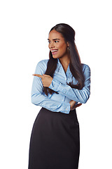 Image showing Happy, business and woman pointing her finger in studio for advertising, marketing or mockup. Happiness, smile and female model with corporate, classy and elegant outfit isolated by white background.