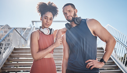 Image showing Black couple, city stairs portrait and fitness with headphones, music and motivation at outdoor workout. Exercise couple, teamwork and support for health, urban training and development of wellness