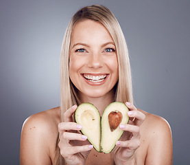 Image showing Skincare, beauty and portrait of woman with avocado in studio for wellness, vitamins and luxury spa. Dermatology, makeup and girl marketing organic, healthy and natural cosmetics for facial treatment