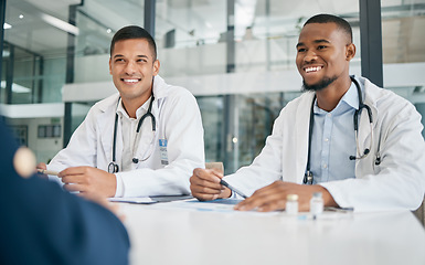 Image showing Teamwork, healthcare and doctors in meeting at hospital with patient. Wellness, consultation and person consulting medical professionals for advice, assistance or help with vaccination information.