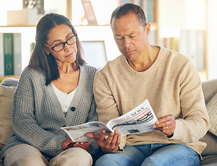 Image showing Senior couple, reading and newspaper on sofa, focus or relax together in morning for global event. Mature man, woman or media paper for international news, information or world crisis on home couch