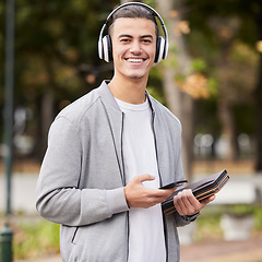 Image showing Smartphone, headphones and student portrait in park for study at university, college or campus scholarship, knowledge and learning. Happy man with music technology with books for exam, test or school