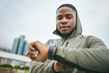 Image showing Time, watch and black man running in city for fitness motivation, training goal and heart performance in Nigeria. Monitor, exercise and African runner with a smart watch for reading health progress