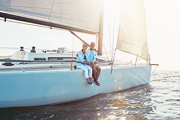 Image showing Happy couple, boat and cruise on ocean in summer sunshine, love and romance on outdoor adventure. Couple, yacht and sea with waves, bonding and peace with luxury, lifestyle and travel for vacation