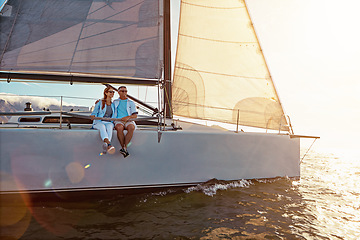 Image showing Yacht, sea and love with a mature couple sailing together on water for holiday, vacation or romance. Boat, ocean and date with a senior man and woman bonding while enjoying a trip on the water