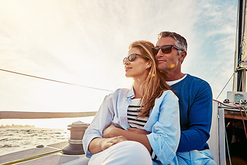 Image showing Yacht, travel and love with a mature couple sitting together on a boat out at sea for a romantic date. Luxury, ocean or summer with a married man and woman on a ship to relax during a trip