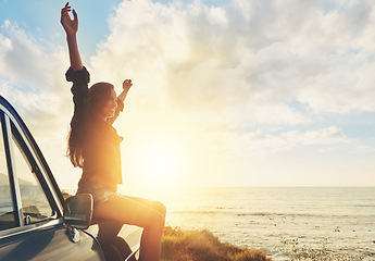 Image showing Travel, sunset and happy woman on car at beach road trip, journey and summer holiday celebration. Celebrate, freedom and retro or vintage girl on outdoor vacation, parking and nature drive by ocean