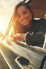 Image showing Portrait, driver and road trip with a black woman in a car at sunset during summer vacation or travel. Nature, window and drive with an attractive young female sitting in transport for adventure