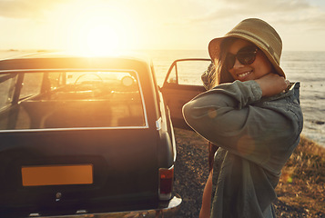 Image showing Woman, road trip and smile for sunset travel, vacation or journey with a view of the ocean in outdoor nature. Happy female traveler smiling in happiness for summer with lens flare for a beach drive