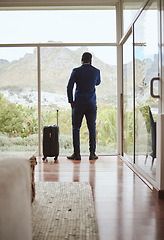 Image showing Phone call, travel and businessman with a phone at a hotel for communication, connection and networking. Contact, talking and back of a black man in conversation on a mobile with luggage on a trip