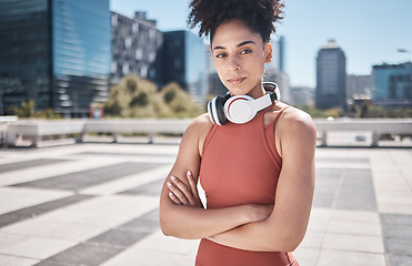 Image showing Music, fitness and black woman in a city portrait for workout, exercise or training motivation, mental health and wellness Face of a sports athlete with headphones technology for audio subscription