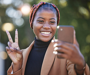 Image showing Face, phone selfie and black woman with peace sign at park outdoors. Technology, cellphone and female with hand gesture taking picture or photo on mobile smartphone for happy memory or social media.