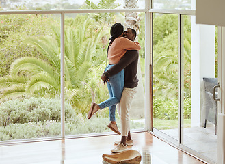 Image showing Black couple, hug and love while happy together in their new house with love and happiness to celebrate anniversary or home. Young man and woman with support, care and joy in a healthy marriage