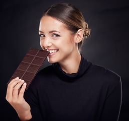 Image showing Chocolate, diet and beauty with woman and skincare with healthy candy, luxury and wellness with food and portrait. Happy with calories, cosmetic and cacao dessert with skin against studio background