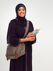 Image showing Portrait, muslim and study with a student woman holding books in studio on a gray background for learning or education. Islam, university and an islamic female at college campus on a scholarship