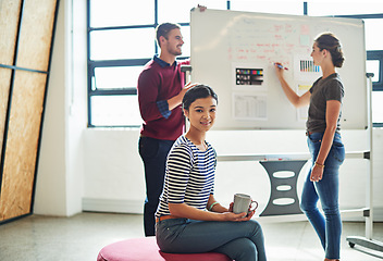 Image showing Team, designer group and board for brainstorming, planning and writing ideas together in startup office. Creative business people, diversity and happiness in workshop with strategy, focus and goals