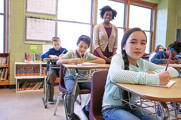 Image showing Learning, kids and student portrait in classroom with notebook for lesson notes and knowledge. School kids, education and development of middle school children writing in books with happy teacher