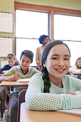 Image showing Portrait, girl and classroom for school, education and learning for exams, test and smile. Teacher, female learner and students focus, thinking and knowledge for development, children and studying