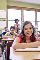 Image showing Happy, students and portrait of girl in classroom with notebook for lesson notes and knowledge. School kids, learning and development of middle school children writing in academic books.