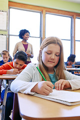 Image showing School, girl and writing in book, education and studying for test, exam and learning in classroom. Teacher, female student and learners with notebooks, focus and thinking for notes and concentration
