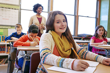 Image showing Portrait, girl in classroom and writing with smile, learning and education for knowledge, focus and book. Teacher, female student and school for studying, development and thinking for test and exam