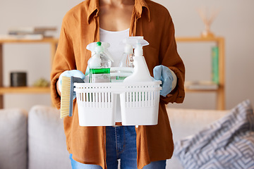 Image showing Cleaning, hygiene and detergent with a woman holding a basket of products as a cleaner in a home. Bacteria, container and spray bottle with a female housekeeper ready to clean with disinfectant