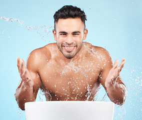 Image showing Cleaning, water splash and portrait of man happy with self care routine, facial hygiene and body hygiene wash. Water drop, bathroom skincare hydration and beauty model with health wellness treatment