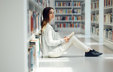 Image showing Education, library and woman reading a book, college learning and thinking of research knowledge. Books, scholarship and student with an idea for university information while studying on campus