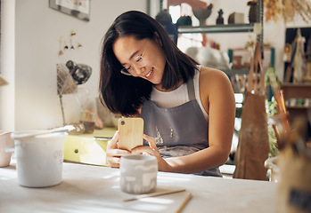 Image showing Phone photo, pottery and woman at a studio for art entrepreneurship, social media update and creative job. Small business, creativity and girl with a mobile picture of professional clay work