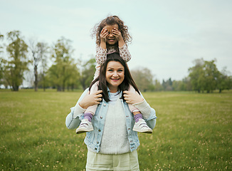 Image showing Mom, girl and sitting on shoulders outdoor for happiness, bonding or care in nature together in spring. Woman, kid and happy family for vacation, love or play on grass field for fun at Toronto park