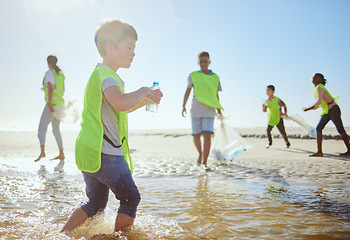 Image showing Plastic recycling, children and beach cleaning for eco friendly sustainability, teamwork and global conservation. Waste recycle project, youth team action and fun in ocean for sea pollution clean up