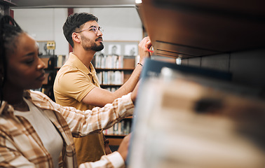 Image showing Library, student and books of a man reading book information for college research. School, learn and study knowledge of students ready for studying, learning and campus scholarship education