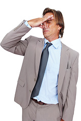 Image showing Businessman, holding nose and disgust for bad smell, odor or breath against white studio background. Isolated man wearing suit with disgusted expression for stink, scent or aroma on white background