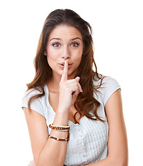 Image showing Portrait, secret and a woman with her finger on lips in studio on a white background for gossip. Face, whisper and confidential with an attractive young female being quiet with a hand sign or gesture